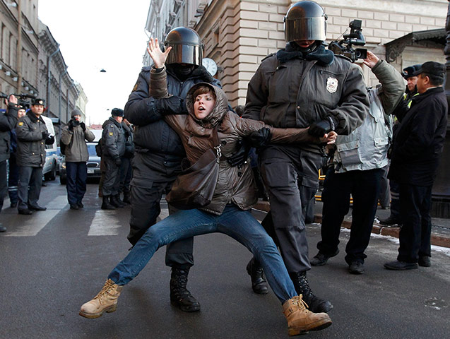 Russian police detain a participant