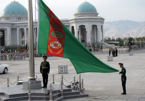 Soldiers raise the national flag during a military parade marking Turkmenistan's Independence Day, in Ashgabat on October 27, 2013. AFP PHOTO / STR (Photo credit should read -/AFP/Getty Images)