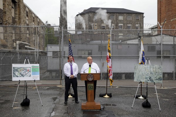 Maryland Gov. Larry Hogan, center, speaks alongside Maryland Secretary of Public Safety and Correctional Services Stephen Moyer at Baltimore City Detention Center, Thursday, July 30, 2015, in Baltimore, to announce his plan to immediately shut down the jail. The jail grabbed headlines in 2013 after a sweeping federal indictment exposed a sophisticated drug- and cellphone-smuggling ring involving dozens of gang members and correctional officers. (AP Photo/Patrick Semansky)