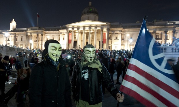 Million Mask March protesters in Trafalgar Square, London