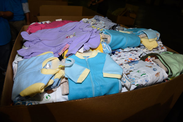 EDISON, NJ - SEPTEMBER 07: Atmosphere as Emma Ferrer, Audrey Hepburn's Granddaughter, Joins UNICEF And UPS Volunteers In Packing Thousands Of Winter Survival Kits For Syrian Children on September 7, 2014 in Edison, New Jersey. (Photo by Dave Kotinsky/Getty Images for UNICEF)