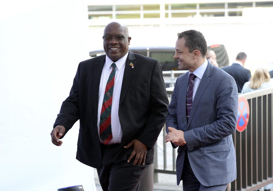 Saint Kitts and Nevis’ Prime minister Timothy Harris (L) arrives for an EU-CELAC summit in Brussels on June 10, 2015 at the European Union headquarters in Brussels. His country provides visa free travel to European nations that are part of the Schengen area. Harris banned Syrians from obtaining dual citizenship from his tiny island nation on Nov. 24, 2015. (Photo by THIERRY CHARLIER/AFP/Getty Images)