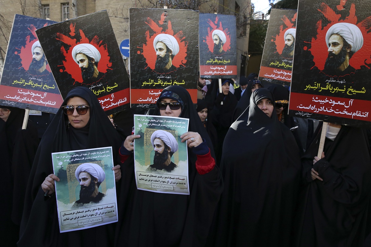 Iranian demonstrators hold posters of Sheikh Nimr al-Nimr, a prominent opposition Saudi Shiite cleric, during a protest denouncing his execution, in front of the Saudi Embassy, in Tehran, Sunday, Jan. 3, 2016. Saudi Arabia announced the execution of al-Nimr on Saturday along with 46 others. Al-Nimr was a central figure in protests by Saudi Arabia's Shiite minority until his arrest in 2012, and his execution drew condemnation from Shiites across the region. (AP Photo/Vahid Salemi)
