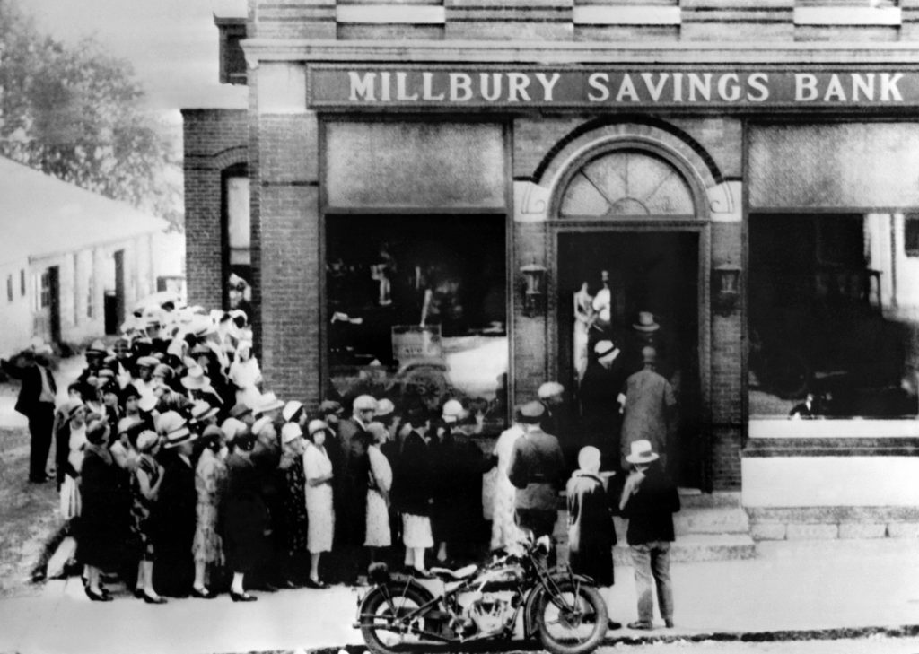 TO GO WITH AFP STORY : " The Great Crash of 1929, and lessons taming the crisis of 2008 ". (FILES) - This photo dated 1929, shows a view of people rushing to a saving bank in Millbury, Massachusetts, October 24th as Wall Street in New-york crashed sparking a run on banks that spread accross the country. October 1929 was the beginning of the 1929 Stock Market Crash. The financial firestorm that has spread around the world from the US home loan market in the last 14 months is now in 2008 widely described as the biggest crisis since the crash of 1929, but with some big differences. Probably a "once-in-a-century type of event," in the words of former US Federal Reserve chairman Alan Greenspan, "outstripping anything I've seen." For Macquarie Private Wealth associate director Marcus Droga, the collapse of Lehman brothers and other Wall Street distress dignals on Monday probably marked "more in one day of financial history than we've seen since the great crash of 1929." AFP PHOTO (Photo credit should read OFF/AFP/Getty Images)