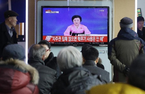 People watch a TV news program showing North Korea's announcement that it conducted a hydrogen bomb test, at the Seoul Railway Station in Seoul, South Korea. 