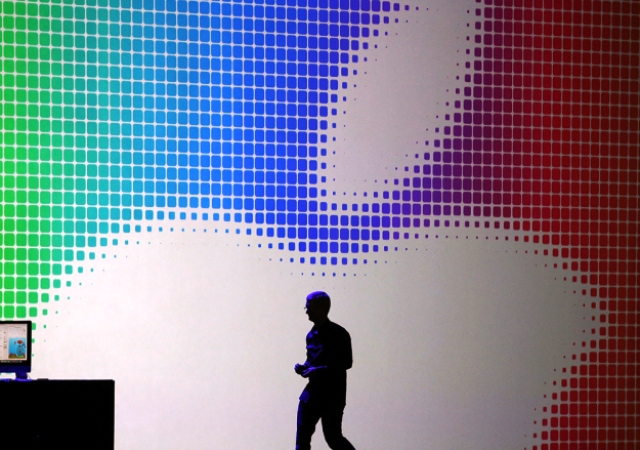 Image Source: BGR - A picture of Tim Cooking walking on the podium with the Apple logo showing in the back ground.