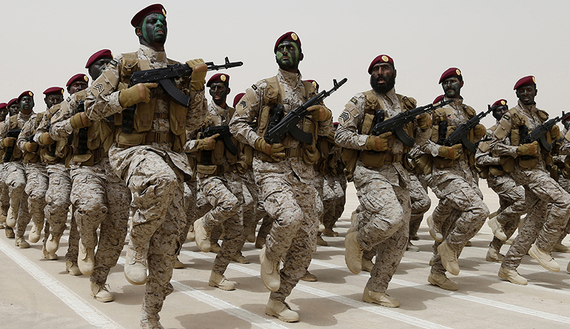 Saudi soldiers march during Abdullah's Sword military drill in Hafar Al-Batin, near the border with Kuwait