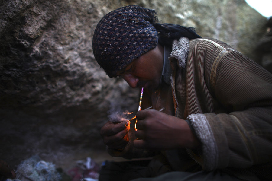 Ahmad, who wouldn't give his last name, smokes heroin. He lives in a makeshift village filled with drug addicts called Kamar Kulagh, on the outskirts of the western Afghan city of Herat. Image credit: www.npr.org