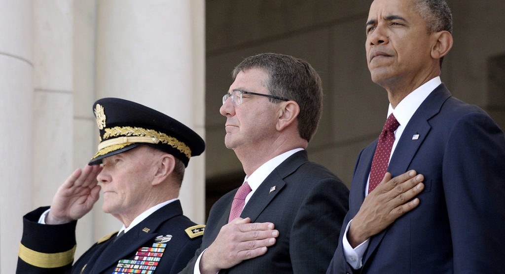 ARLINGTON, VA - MAY 25: (L to R) Chairman of the Joint Chiefs of Staff U.S. Army General Martin Dempsey, U.S. Defense Secretary Ash Carter and U.S. President Barack Obama attend a Memorial Day ceremony at Arlington National Cemetery May 25, 2015 in Arlington, Virginia. Obama, Chairman of the Joint Chiefs of Staff U.S. Army General Martin Dempsey and U.S. Defense Secretary Ash Carter honored fallen soldiers at Arlington on this Memorial Day. (Photo by Olivier Douliery-Pool/Getty Images)