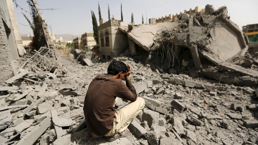 A guard sits on the rubble of the house of Brigadier Fouad al-Emad, an army commander loyal to the Houthis, after air strikes destroyed it in Sanaa, Yemen June 15, 2015. Warplanes from a Saudi-led coalition bombarded Yemen's Houthi-controlled capital Sanaa overnight as the country's warring factions prepared for talks expected to start in Geneva on Monday. REUTERS/Khaled Abdullah TPX IMAGES OF THE DAY - RTX1GJK0