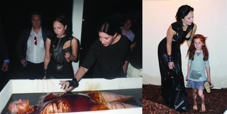 (L) Lady Gaga and Marina Abramovic (of ‘Spirit Cooking’ fame) attend a benefit at “Devil’s Heaven” where guests partook in pretend cannibalism (R) Lady Gaga poses with a “friend” at the same event. Why was an unsupervised young child attending this gruesome event? Credit – Vigilant Citizen