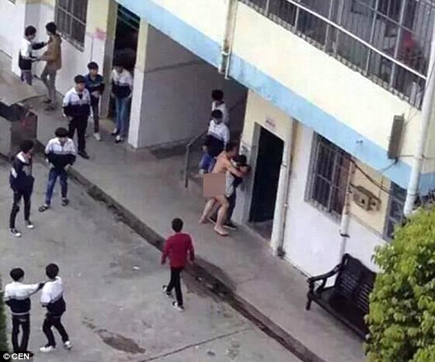 Chinese teacher strips naked in playground and tries to 
